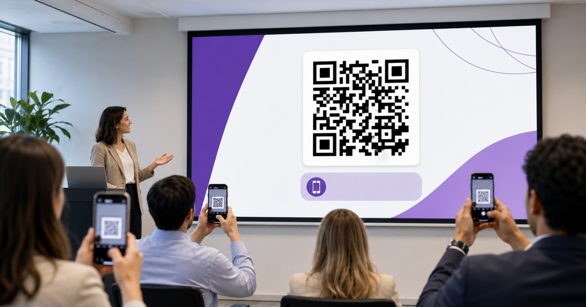 A presentation slide with a QR code being scanned by audience members.